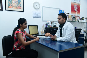 Dr. Rahul Sharma with Patient