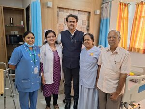 Photo : Post robotic TKR recovery day 2 Standing comfortably without support ! Happy patient!