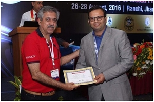 Photo : Dr.Girish motwani receiving IFAS Foot and ankle orthopedic fellowship certificate by IOA president Dr Mandeep Dhillon